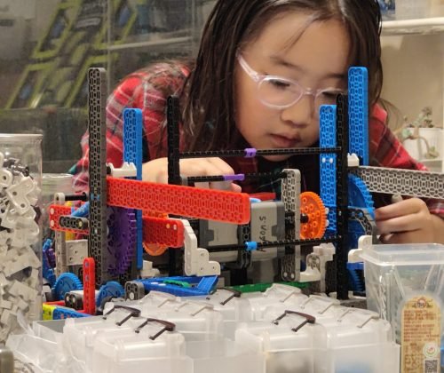 Silver Owl student working on robot